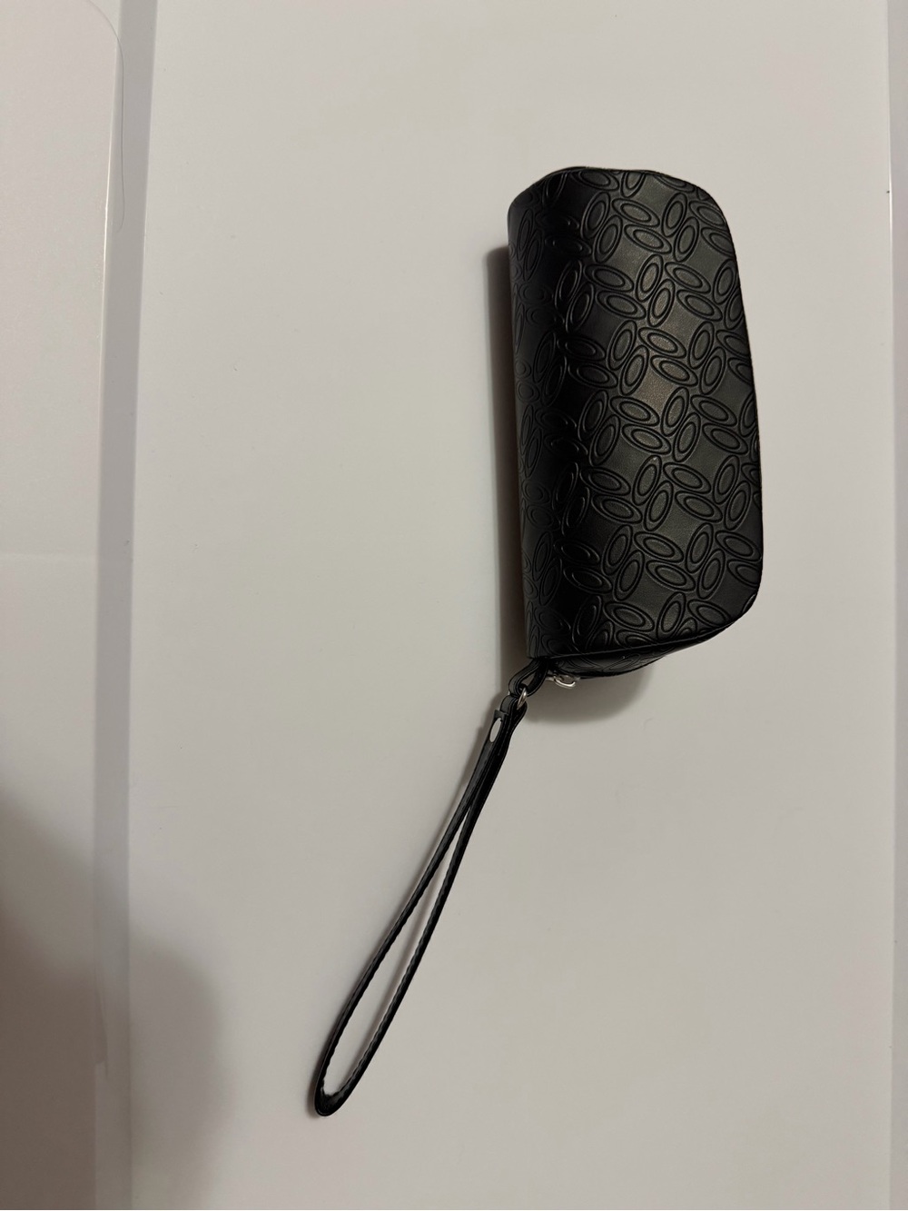 Oakley Black Wristlet with Subtle Oval Pattern